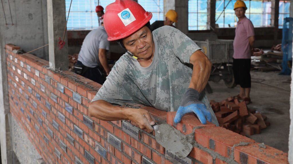 Another one of the bricklaying team