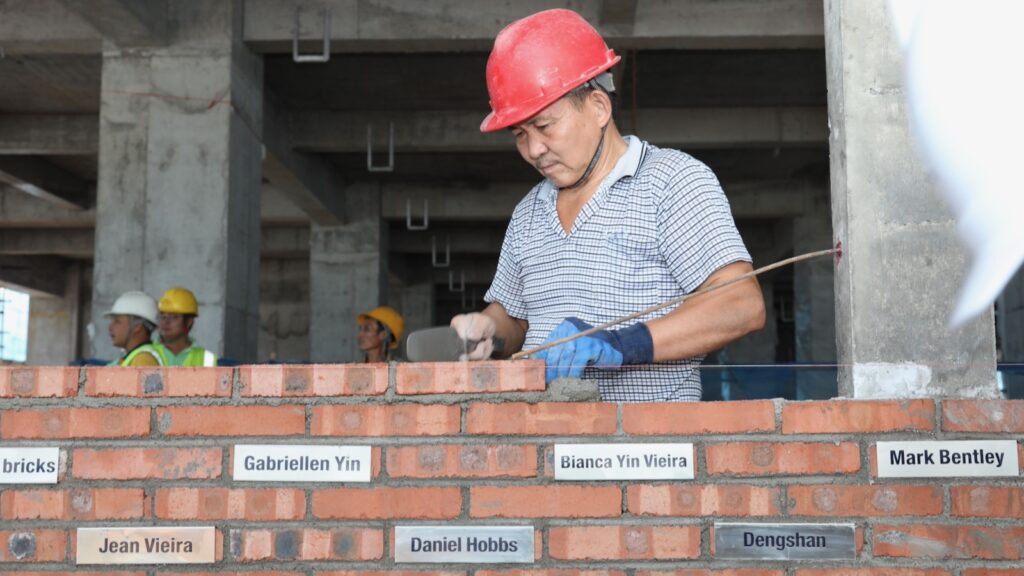 ONe of our team doing the bricklaying