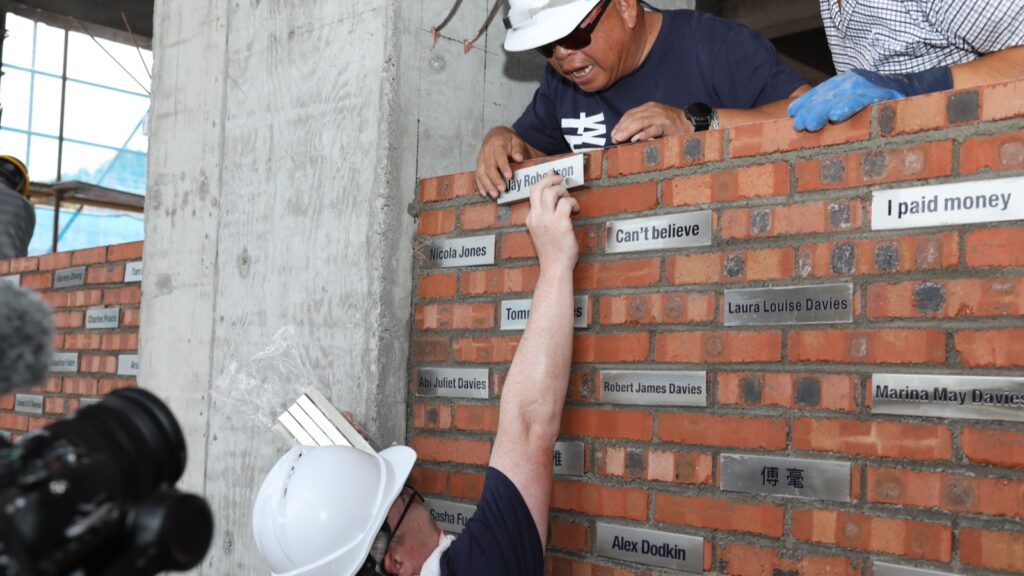 Jay bricklaying for The Plenum wall.