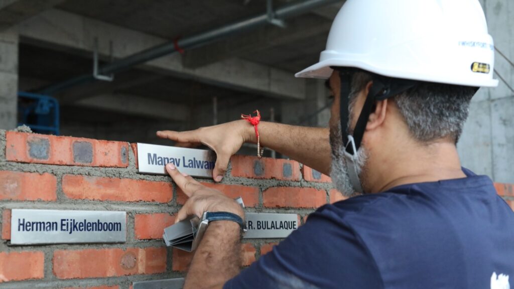 Manish bricklaying for The Plenum wall.