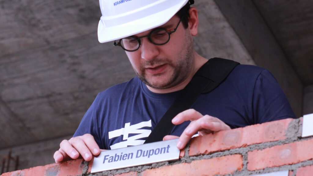 Fabien bricklaying for The Plenum wall.